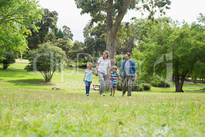 Parents and kids walking in park