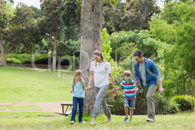 Parents and kids walking in park