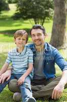 Portrait of a father and boy at park