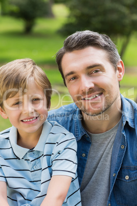 Close-up portrait of father and boy at park