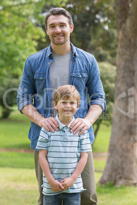 Portrait of a father and boy at park