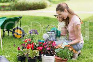 Mother and daughter engaged in gardening