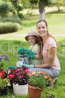 Mother and daughter engaged in gardening