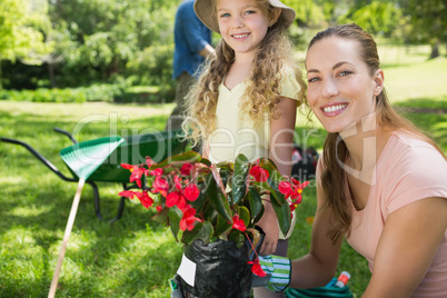 Mother and daughter engaged in gardening