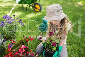 Little young girl engaged in gardening
