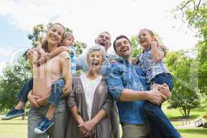 Portrait of cheerful extended family at park