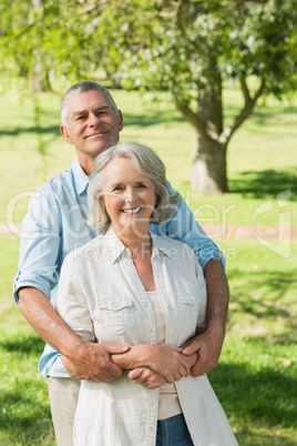 Loving and happy mature couple at park