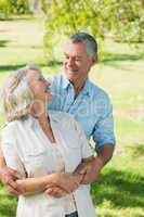 Loving and happy mature couple at park