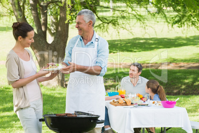 Family having lunch in the lawn