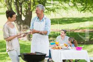 Family having lunch in the lawn