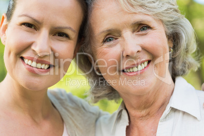 Smiling mature woman with adult daughter