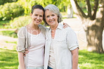 Portrait of a mature woman with daughter at park