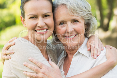 Smiling mature woman with adult daughter