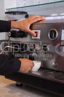 Barista making cup of coffee