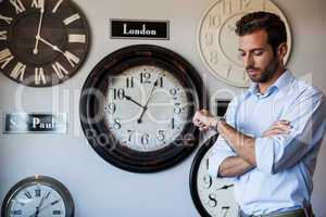 Handsome businessman checking the time