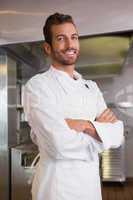 Happy chef standing with arms crossed