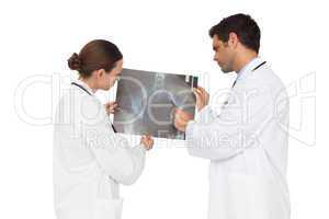 Medical team analysing an xray together