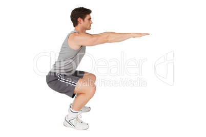 Fit man doing squats