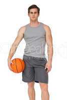 Fit man holding basketball