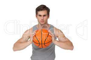 Fit man holding basketball about to throw