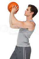 Fit man holding basketball about to shoot