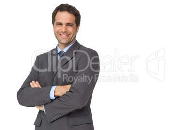 Handsome businessman smiling at camera with arms crossed Handsome businessman smiling at camera with arms crossed