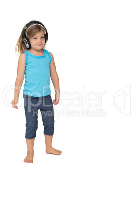 Cute little girl listening to music