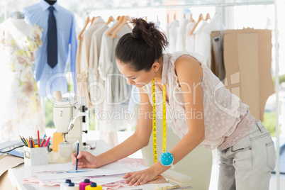 Female fashion designer working on her designs