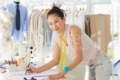 Female fashion designer working on her designs