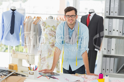 Portrait of a smiling handsome male fashion designer