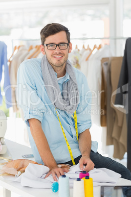 Young male fashion designer at work