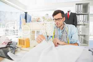 Male tailor sewing in workshop