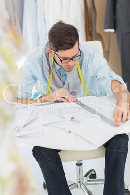 Male fashion designer working on his designs