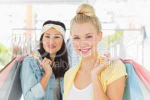 Happy young women with shopping bags
