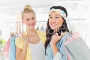 Portrait of young women with shopping bags