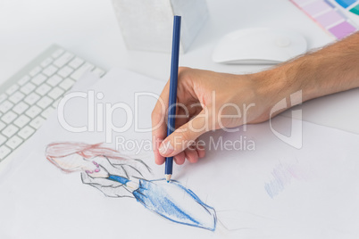 Extreme closeup of a fashion designer working on designs