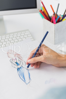 Extreme closeup of a fashion designer working on designs