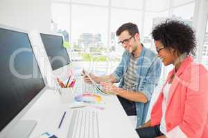 Casual young couple working on computer