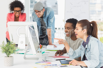 Artists working at desk in creative office