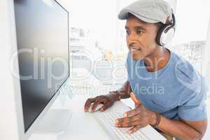 Male artist using computer in the office