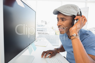Male artist using computer in the office