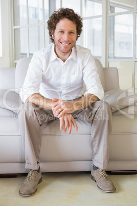 Portrait of a well dressed young man at home