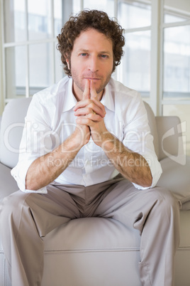 Portrait of a well dressed young man at home