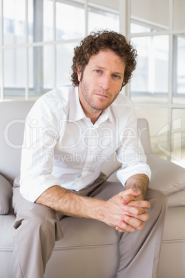 Portrait of a well dressed young man at home