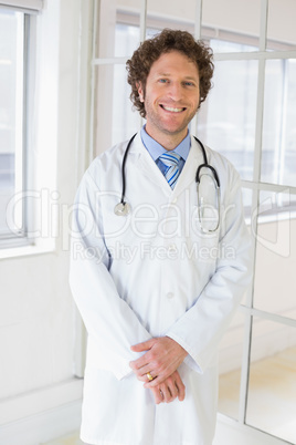 Happy handsome male doctor in hospital