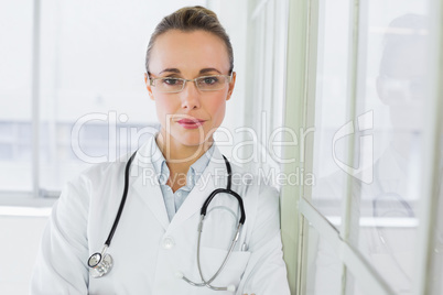 Beautiful serious female doctor in hospital