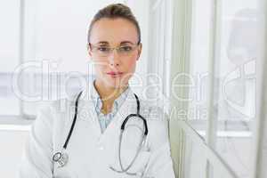 Beautiful serious female doctor in hospital