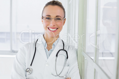 Beautiful happy female doctor in hospital