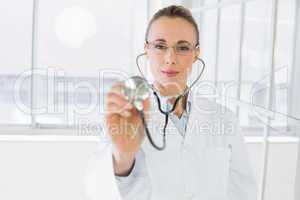 Female doctor with stethoscope in hospital