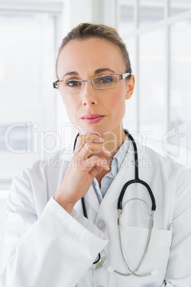 Serious beautiful female doctor in hospital